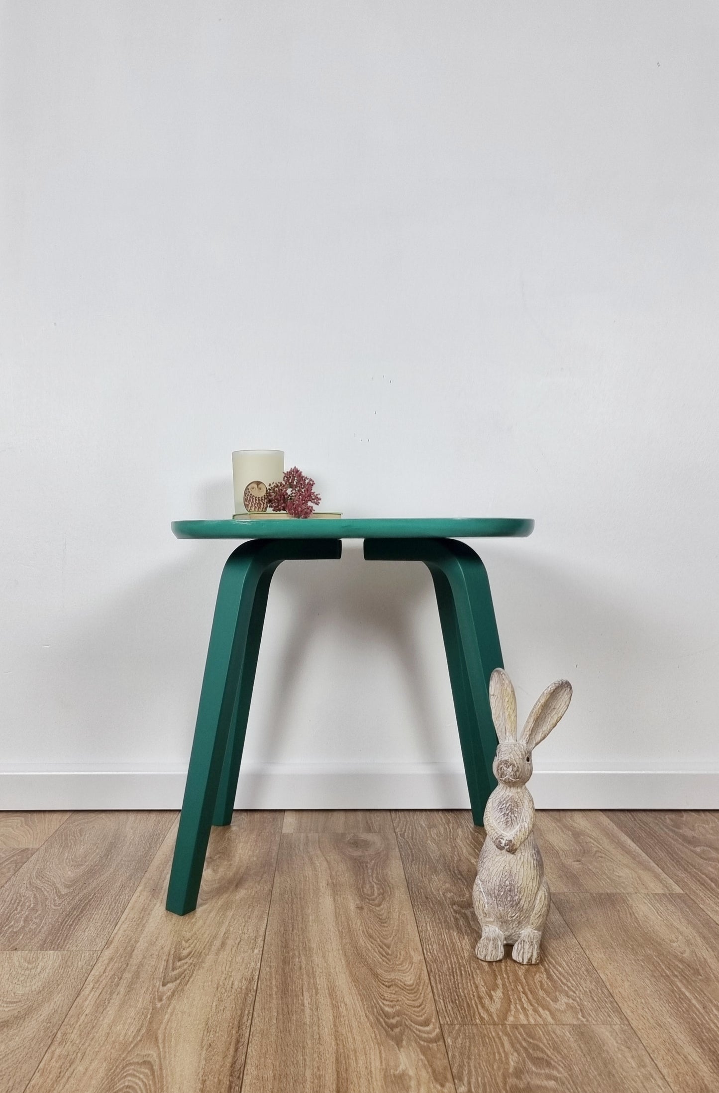 Side table hand painted with green legs and flowers on the top of the table